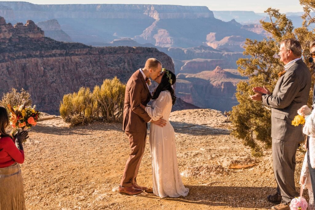 First Kiss during wedding ceremony at Moran Point South Rim