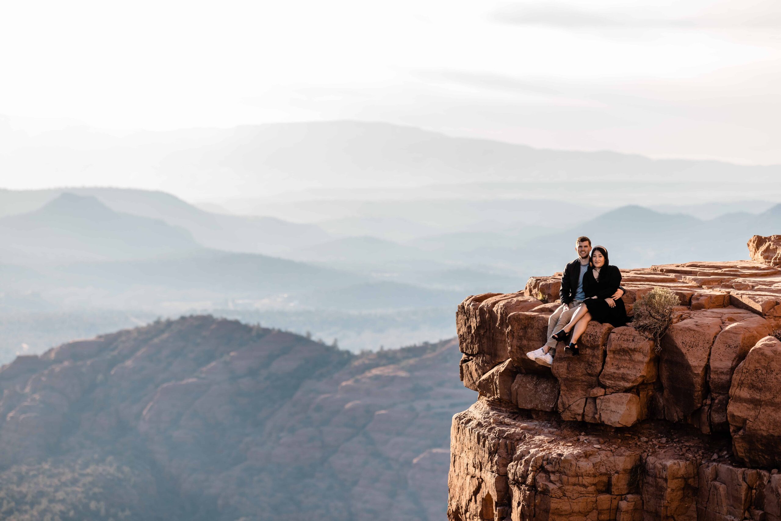 Adventurous couple hiking in Sedona for their Cathedral Rock Sunset Engagement Photos