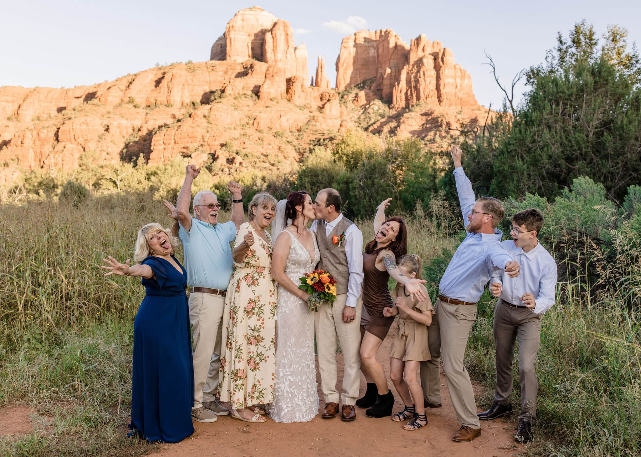 family cheers alongside couple at monument valley arizona elopement