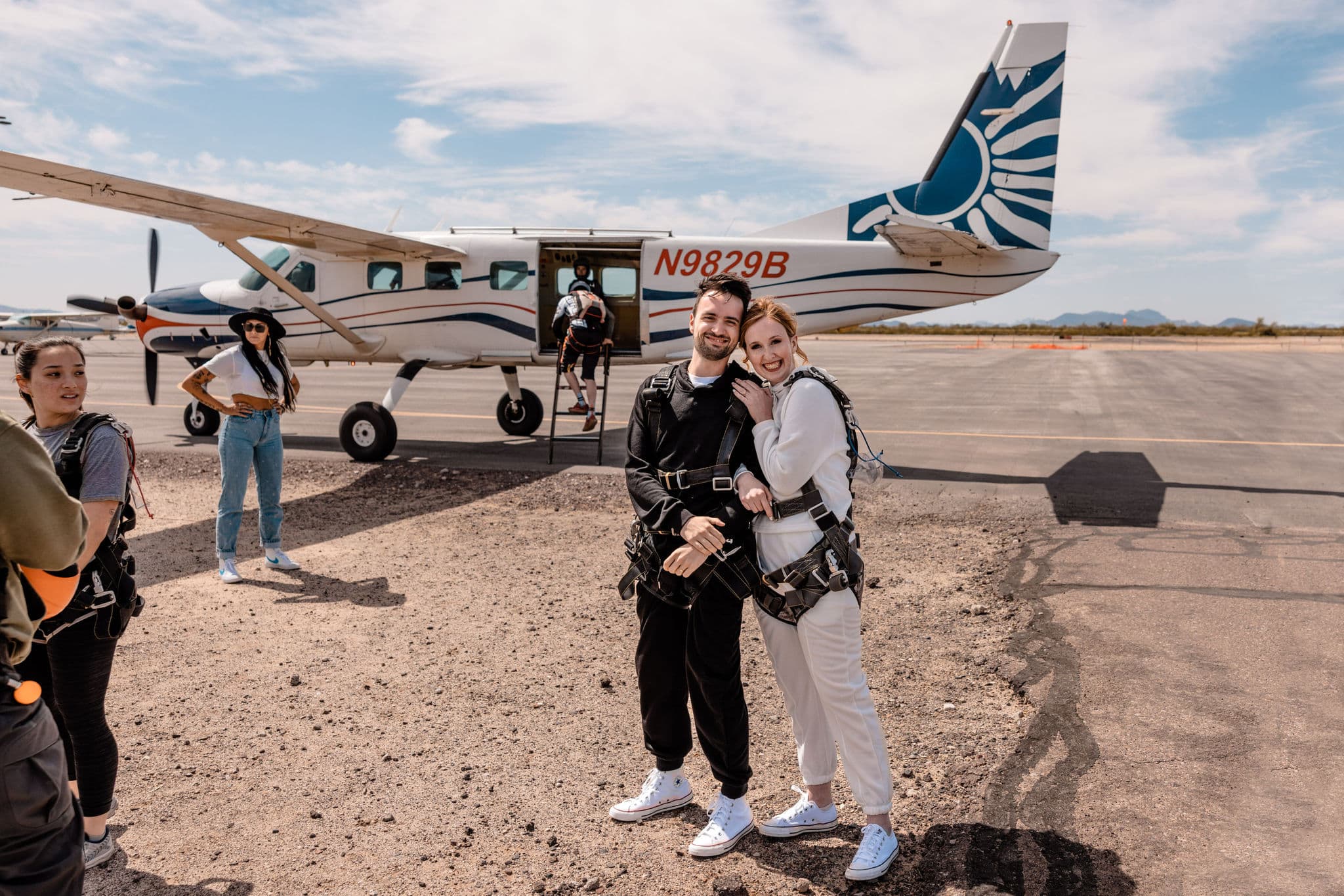 couple embraces before skydiving