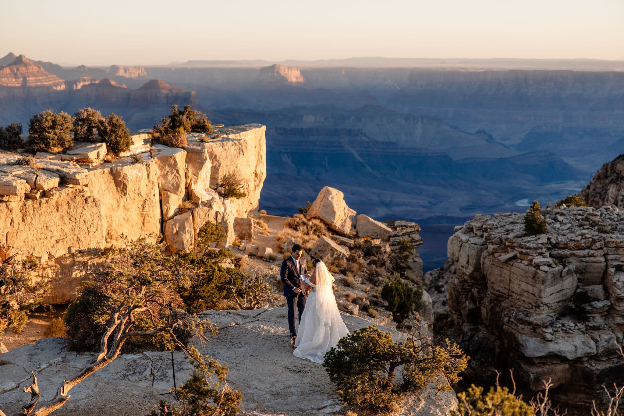 couple exchanges vows at sunrise Grand Canyon elopement