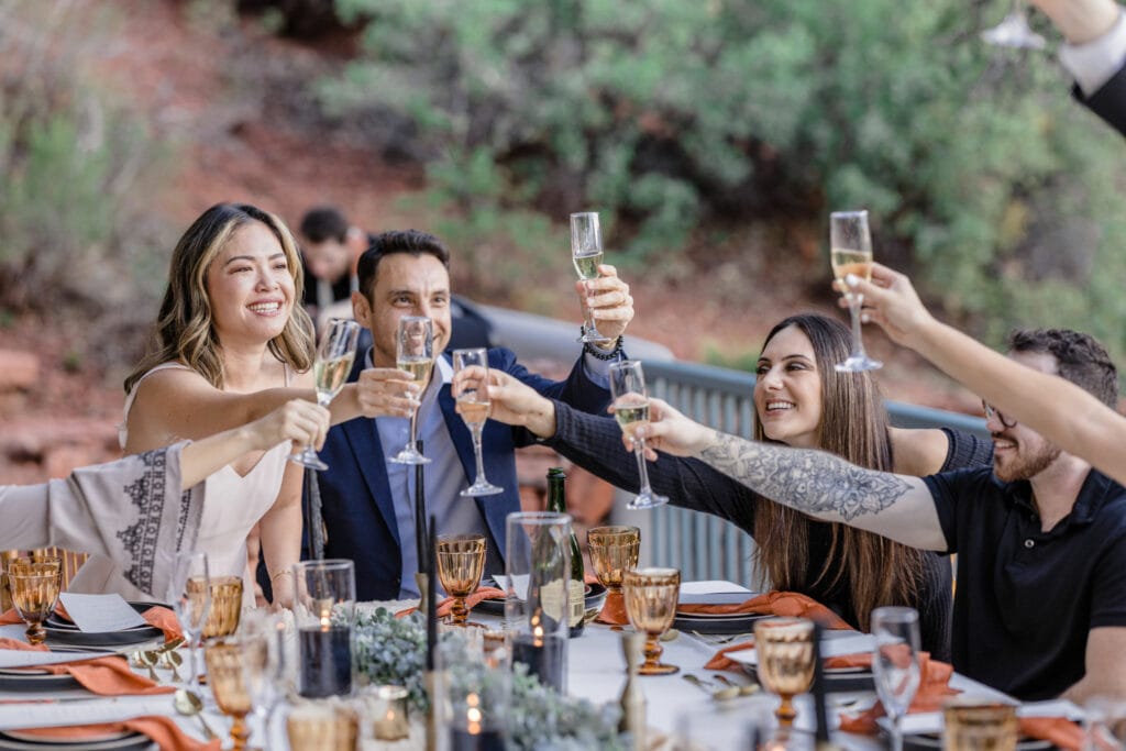 guests give toasts at outdoor forest wedding