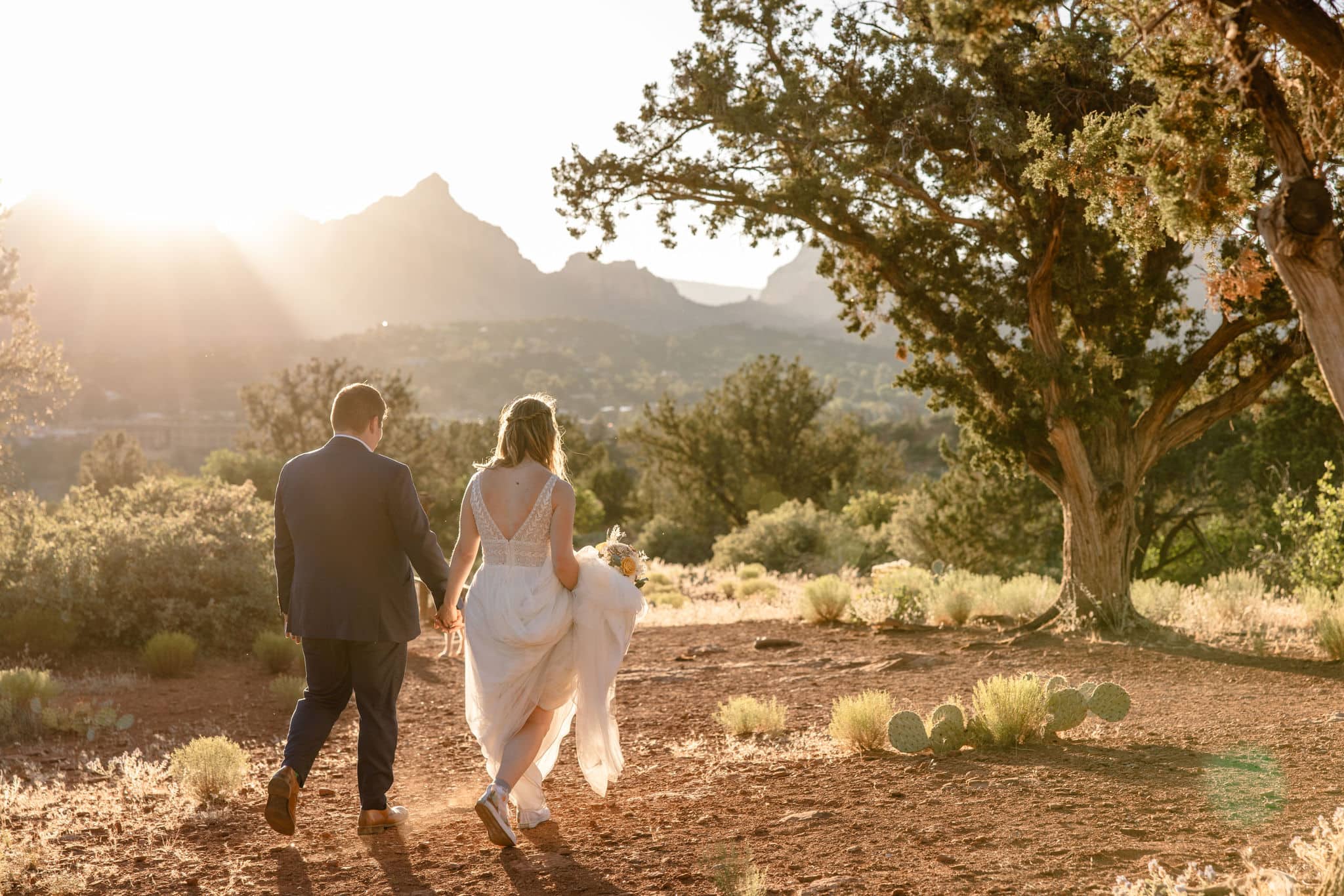 couple walks along Arizona sunset outdoor elopement location